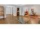 Open concept living room with hardwood floors adjoining other rooms at 1020 Riverside Rd, Roswell, GA 30076