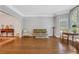 Spacious living room with hardwood floors and large arched window at 1020 Riverside Rd, Roswell, GA 30076