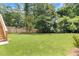 Expansive backyard with lush green lawn and mature trees, offering a private and serene outdoor space at 267 Green Hill Rd, Sandy Springs, GA 30042