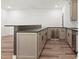 Wet bar with grey cabinets, stainless steel appliances, and stone countertops at 267 Green Hill Rd, Sandy Springs, GA 30042