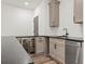 Wet bar with granite countertops, stainless steel appliances, and gray cabinets at 267 Green Hill Rd, Sandy Springs, GA 30042