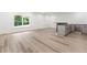 Spacious basement featuring hardwood floors, a window with a view, and a bar area at 267 Green Hill Rd, Sandy Springs, GA 30042