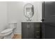 Elegant bathroom with a vanity, a white countertop, a wood-look cabinet, and modern fixtures at 267 Green Hill Rd, Sandy Springs, GA 30042