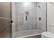 New bathroom showcasing a glass shower with gray tile walls, mosaic tile floor, and modern fixtures at 267 Green Hill Rd, Sandy Springs, GA 30042