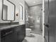 Modern bathroom featuring a tiled shower, dark vanity, and updated fixtures at 267 Green Hill Rd, Sandy Springs, GA 30042
