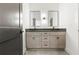 Bathroom featuring a double sink vanity with stone countertop, and matching mirrors at 267 Green Hill Rd, Sandy Springs, GA 30042