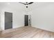 Bright, spacious bedroom features sleek wood floors, neutral walls, and modern doors for a cozy and stylish aesthetic at 267 Green Hill Rd, Sandy Springs, GA 30042