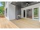 Spacious wood deck with an outdoor fireplace and sliding glass doors at 267 Green Hill Rd, Sandy Springs, GA 30042