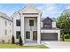 New construction home with painted brick, modern design, and professional landscaping at 267 Green Hill Rd, Sandy Springs, GA 30042