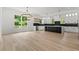 Elegant kitchen features a central island, stainless steel appliances, and abundant natural light at 267 Green Hill Rd, Sandy Springs, GA 30042