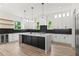 Contemporary kitchen featuring a large island, wine cooler, and stainless steel appliances at 267 Green Hill Rd, Sandy Springs, GA 30042