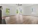 Living room featuring hardwood floors, a fireplace, and several windows at 267 Green Hill Rd, Sandy Springs, GA 30042