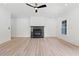 Living room with wood floors and a stone fireplace at 267 Green Hill Rd, Sandy Springs, GA 30042