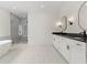 Elegant main bathroom featuring a freestanding tub, glass shower, and double vanity with dark granite countertops at 267 Green Hill Rd, Sandy Springs, GA 30042