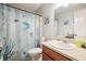 Bathroom with a vanity and a tub-shower combination at 408 Walnut Dr, Woodstock, GA 30189