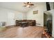 Cozy living room with wood-look vinyl floors, vaulted ceiling, and a ceiling fan at 408 Walnut Dr, Woodstock, GA 30189
