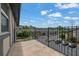 Balcony view showcasing the community, with ample parking and mature trees in the background at 6851 Roswell Rd # C7, Atlanta, GA 30328
