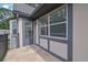 A cozy, covered balcony with a door and windows offers a private outdoor space at 6851 Roswell Rd # C7, Atlanta, GA 30328