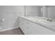 Bathroom featuring double sinks with a marble countertop and modern cabinetry at 6851 Roswell Rd # C7, Atlanta, GA 30328