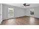 Spacious bedroom boasts lots of natural light, ceiling fan, and wood-look floors at 6851 Roswell Rd # C7, Atlanta, GA 30328