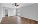 This bedroom features a neutral color palette and wood-look flooring at 6851 Roswell Rd # C7, Atlanta, GA 30328