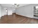 Spacious living room with hardwood floors and a bright sliding door to the back yard at 6851 Roswell Rd # C7, Atlanta, GA 30328
