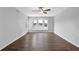 Bright and spacious living room with hardwood floors, a ceiling fan, and a cozy window seat with great outdoor views at 6851 Roswell Rd # C7, Atlanta, GA 30328