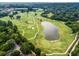 Panoramic aerial shot of a well-manicured golf course with a serene lake at 8 Collier Nw Rd # A1, Atlanta, GA 30309