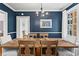Charming dining room with hardwood floors, blue walls, and a wooden dining table at 8 Collier Nw Rd # A1, Atlanta, GA 30309