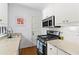 Bright kitchen with stainless steel appliances and granite countertops at 8 Collier Nw Rd # A1, Atlanta, GA 30309