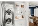 Conveniently located laundry room featuring a stacked washer and dryer unit at 8 Collier Nw Rd # A1, Atlanta, GA 30309