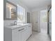 Bathroom featuring double sink vanity with modern fixtures and walk-in shower at 1322 Thurgood Sw St, Atlanta, GA 30314
