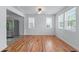 Bright dining room with hardwood floors, white walls, and natural light from windows at 1322 Thurgood Sw St, Atlanta, GA 30314
