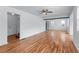 Open living room features hardwood floors, a ceiling fan, and neutral walls at 1322 Thurgood Sw St, Atlanta, GA 30314