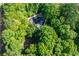 An aerial view of a beautiful home nestled among lush trees offering great privacy at 1811 Fountain Hill Ct, Duluth, GA 30097