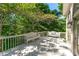 Inviting back deck with seating amidst a lush green backdrop, perfect for relaxation at 1811 Fountain Hill Ct, Duluth, GA 30097