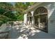 Cozy outdoor space with seating, offering views of the surrounding greenery through arched windows at 1811 Fountain Hill Ct, Duluth, GA 30097