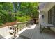Outdoor deck space featuring a stainless steel grill and seating overlooking lush greenery at 1811 Fountain Hill Ct, Duluth, GA 30097