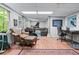 Finished basement area includes comfortable seating, workout machines, and a workspace at 1811 Fountain Hill Ct, Duluth, GA 30097