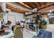 Unfinished basement area with exposed beams, storage shelves and a workbench at 1811 Fountain Hill Ct, Duluth, GA 30097