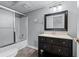 Bathroom features a shower and bathtub combination with a vanity and a large framed mirror at 1811 Fountain Hill Ct, Duluth, GA 30097