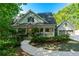 Charming home with a welcoming front porch, a well-manicured lawn, and an attached garage at 1811 Fountain Hill Ct, Duluth, GA 30097