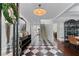 Elegant foyer with a black-and-white tiled floor and staircase at 1811 Fountain Hill Ct, Duluth, GA 30097