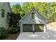 Spacious attached two-car garage features carriage doors and ample parking in a serene setting at 1811 Fountain Hill Ct, Duluth, GA 30097