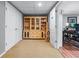 Finished hallway with a built-in bookcase and open doorway to the office space at 1811 Fountain Hill Ct, Duluth, GA 30097
