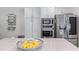 Bright kitchen featuring white cabinets, stainless steel appliances, and a marble countertop at 1811 Fountain Hill Ct, Duluth, GA 30097