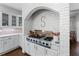 Custom kitchen with brick arch over a stainless steel range and white cabinets at 1811 Fountain Hill Ct, Duluth, GA 30097