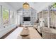 Sunroom featuring large windows, built-in shelving and stylish seating at 1811 Fountain Hill Ct, Duluth, GA 30097