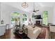 Bright living room with a fireplace, large windows, and access to the backyard at 1811 Fountain Hill Ct, Duluth, GA 30097