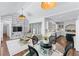 Open-concept living space with sunroom, dining area, and a view of the kitchen at 1811 Fountain Hill Ct, Duluth, GA 30097